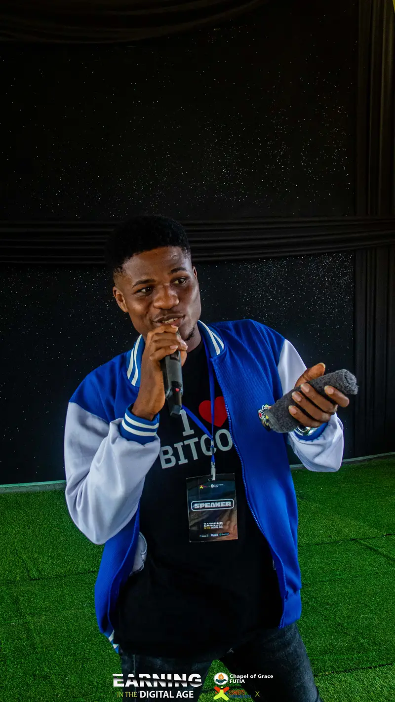 A speaker holding a microphone during an EITDA session